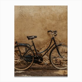 Old Bicycle Against A Wall Canvas Print