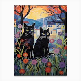 Two Black Cats In A Meadow With A City Scape Background Canvas Print