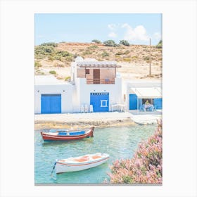 Milos, Greece I Cyclades blue and white fishing village architecture with Bougainvillea pink flowers wild boho nature photography and colorful boats in paradise blue turquoise waters of the Mediterranean sea Canvas Print