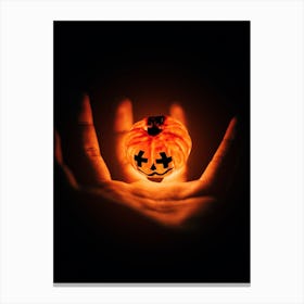 Halloween Pumpkin In A Hand Canvas Print