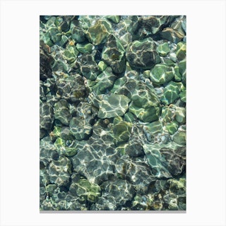 Rocks and teal sea water Canvas Print