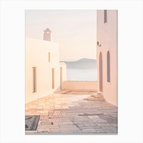 Milos, Greece I Sunset light in Oia Cyclades white architecture with its summer pastel aesthetic with panoramic view photography of the Mediterranean sea ocean and the orange golden light of the greek mountain Canvas Print