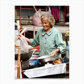 Cheerful Lady Cooking on the Canal Canvas Print