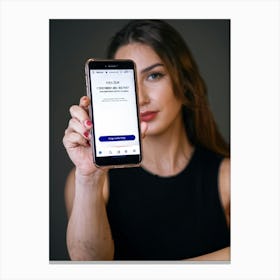 Portrait Of A Woman Holding Up A Smartphone Canvas Print