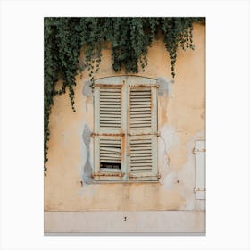 Shutters On A Yellow Wall France Canvas Print