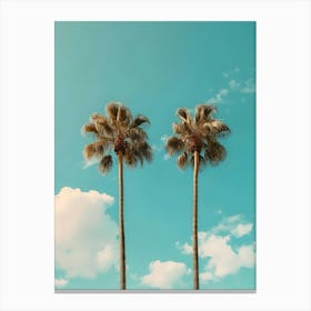 Two Palm Trees Against A Blue Sky Canvas Print