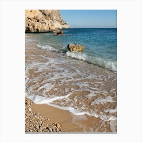 Clear sea water and waves on the beach Canvas Print