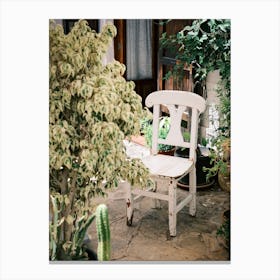 White Chair in garden // Ibiza Travel Photography Canvas Print