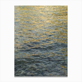 Golden light reflections in sea water Canvas Print