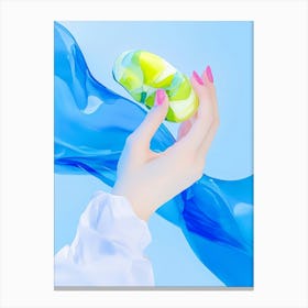 Hand Holding A Blue And Green Bottle Canvas Print