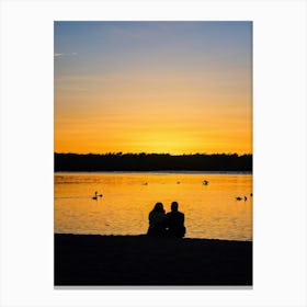 Beach At Sunrise Silhouetted Figure Meditating By The Shore Warm Glow Of Morning Light Reflecting Canvas Print