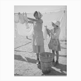 Wife Of Migratory Agricultural Laborer And Daughter Hanging Up The Wash At The Agua Fria Migratory Labor Camp Canvas Print