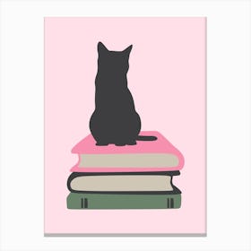 Cat sitting on books Canvas Print