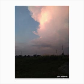 White fluffy clouds over the plain field Canvas Print