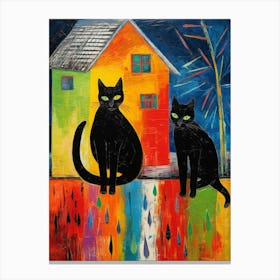 Two Black Cats In Front Of A Colourful House  Canvas Print