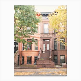 New York, USA I Street architecture with aesthetic orange autumn in the residential district of Brooklyn with cozy houses photography for a film movie or TV series cityscape with Carrie Bradshaw's apartment loft Canvas Print