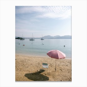 Pink Umbrella On The Beach Canvas Print