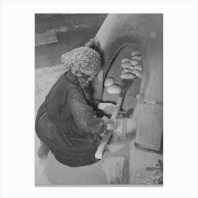 Spanish American Woman Removing Baked Bread From Outdoor Earthen Oven By Means Of A Long Wooden Paddle Canvas Print