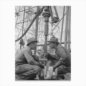 Oil Drillers Talking With Bits In Front Of Them And Drilling Equipment In Background, Kilgore, Texas By Russell Canvas Print