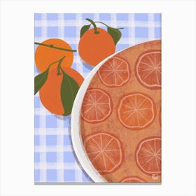Orange Cake On Blue Tablecloth Canvas Print