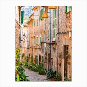Mallorca Spain. Beautiful view of idyllic street in Valldemossa village on Mallorca island, Spain. Experience the charm and beauty of Valldemossa village on Mallorca island with its idyllic streets and picturesque buildings. Canvas Print