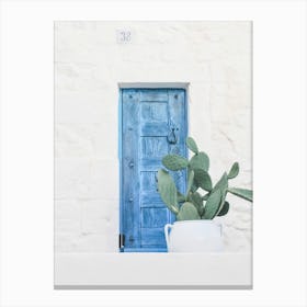 Puglia, Italy I The minimalist blue door photography and boho cactus in authentic Mediterranean Ostuni village on a geometric white wall with a retro vintage aesthetic during the Italian Indian pastel summer Canvas Print