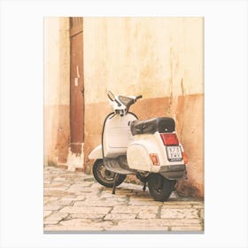 Puglia, Italy I Vintage retro scooter vespa in the summer pastel yellow aesthetic streets in Tuscany in a village with the architecture photography of the Italian countryside to experience la dolce vita Canvas Print