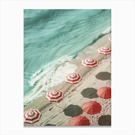 Red Umbrellas On The Beach Canvas Print