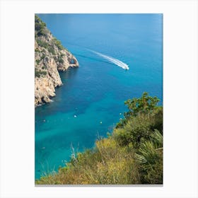 Cliffs and boat in a Mediterranean bay Canvas Print