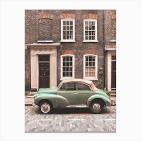 London, England I Vintage retro car on a street with urban industrial architecture and brick facade with the nostalgic aesthetic photography of a picturesque authentic British street urban city landscape Canvas Print