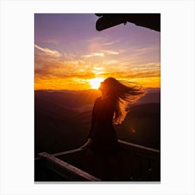 Woman Basking In Sunsets Glow On A Mountain Porch Silhouette Against A Sky Painted With Hues Of Or (3) Canvas Print