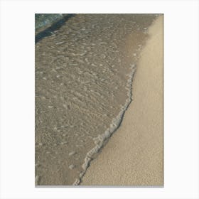 Clear sea water and sand on the beach Canvas Print