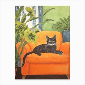Black Cat Sitting On Orange Sofa Canvas Print