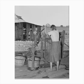 Daughter Of Tenant Farmer Living Near Muskogee, Oklahoma, Pumping Water Out Of Tub,See General Caption Number Canvas Print