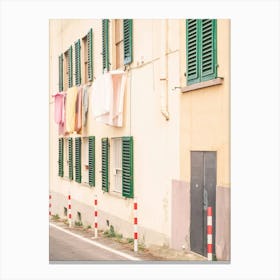 Florence, Italy I Street photography in pastel yellow summer colors in Fiesole village in Tuscany with its laundry drying in the window like la dolce vita of italian everyday daily life scene Canvas Print