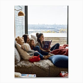 Family Engrossed In A Book Lounged Together On A Plush Sofa In A Warm Ambient Light Filled Living (1) Canvas Print