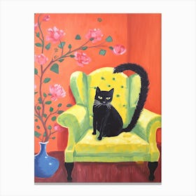 Black Cat Sitting In An Green Sofa Canvas Print