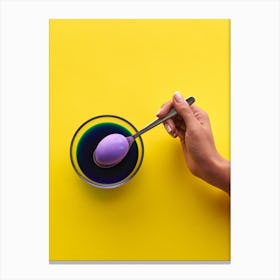 Hand Holding Purple Ice Cream On Yellow Background Canvas Print