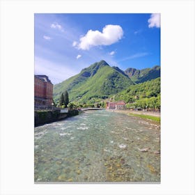 San Pellegrino terme rover from a bridge beautiful mountain in the background green mountain and a river clean water Canvas Print