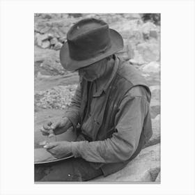 Gold Prospector Putting Flakes Of Gold Which He Has Recovered Through Wet Washing And Panning Into Bottle Canvas Print