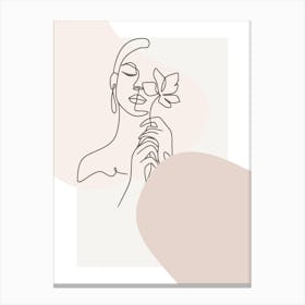 Woman Holding A Flower Canvas Print
