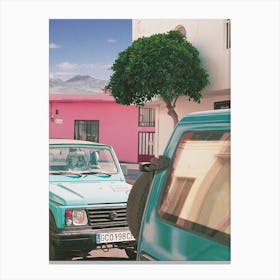 Turquoise Cars And A Pink House Canvas Print
