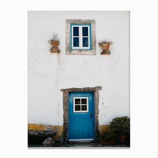 The Tiny Blue Door In A Village In Portugal Canvas Print
