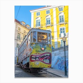 Bright yellow cable car with graffiti in Lisbon, Portugal - summer street and travel photography by Christa Stroo Photography Canvas Print