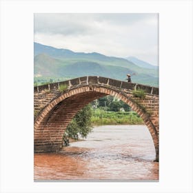 Crossing a bridge in Shaxi, Yunnan, China Canvas Print