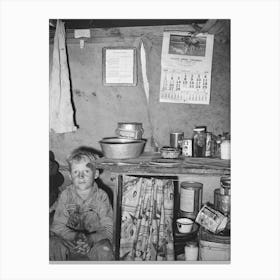 Child Of Migrant Sitting By Kitchen Cabinet In Tent Home Near Edinburg, Texas By Russell Lee Canvas Print
