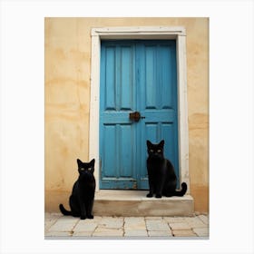 Two Cats In Front Of A Blue Door Canvas Print