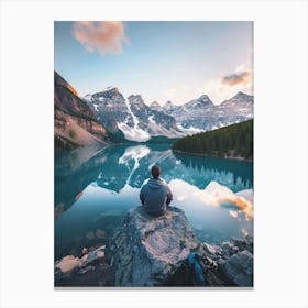 Man Sitting On Rock Overlooking Lake Canvas Print