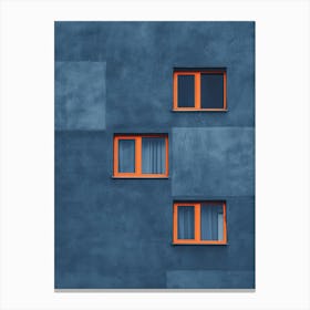 Blue Building With Orange Windows Canvas Print