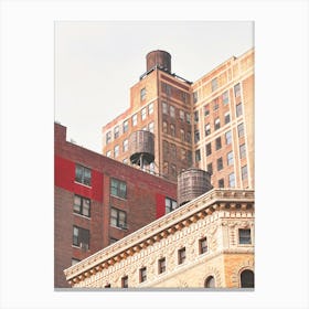 New York, USA I Roofs with water tanks in skyline with its minimalist industrial red brick new yorker loft architecture in a red aesthetic with the retro vintage style of old film photography Canvas Print